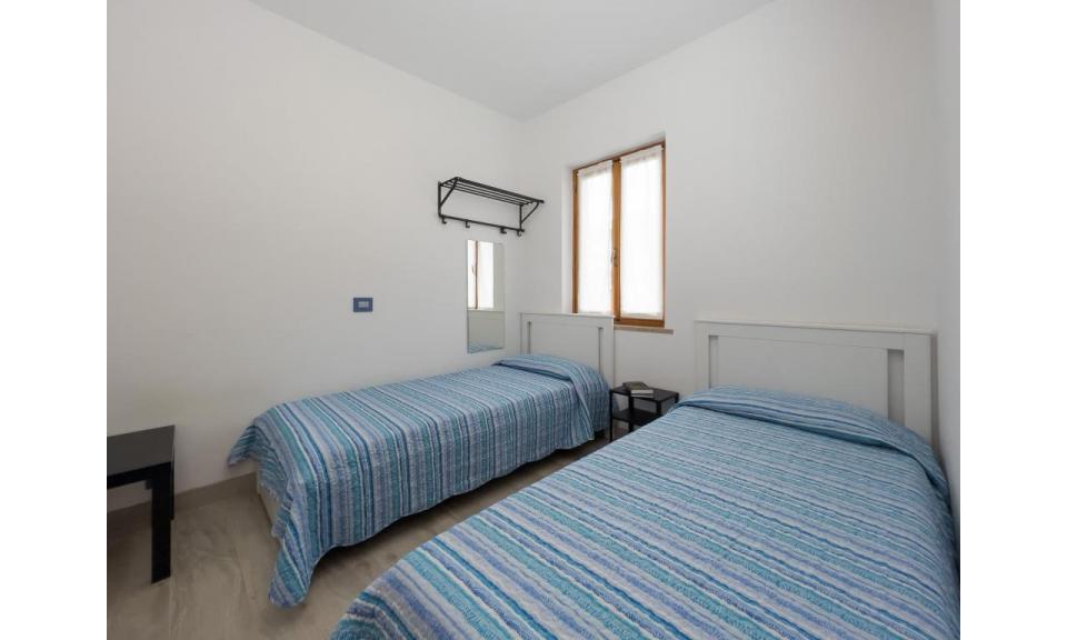 appartament VILLAGGIO GIARDINO: C6/VSI - chambre avec deux lits (exemple)